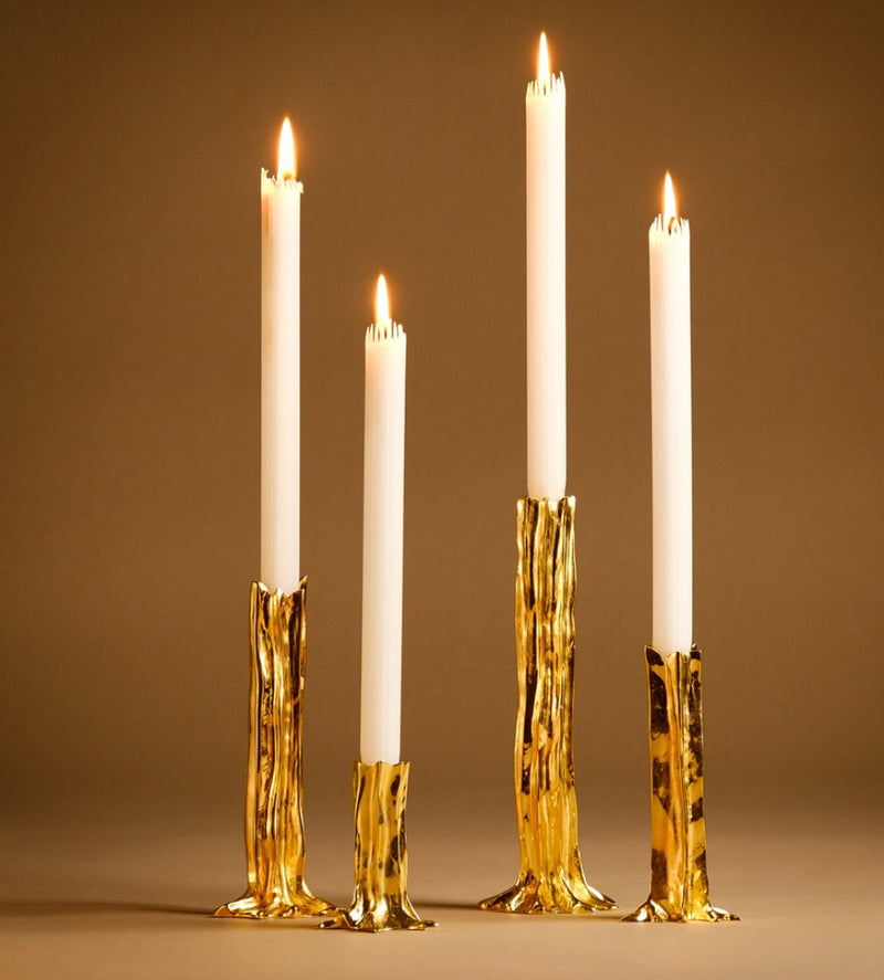 Limited edition Barbara Palatin gold candle holders with candles. Shaped in a tree trunk like form.