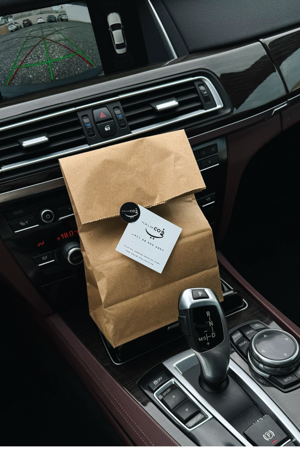 Take away paper bag from Halm Cafe pick up and take away service at 705 Jumeirah Beach Road.
