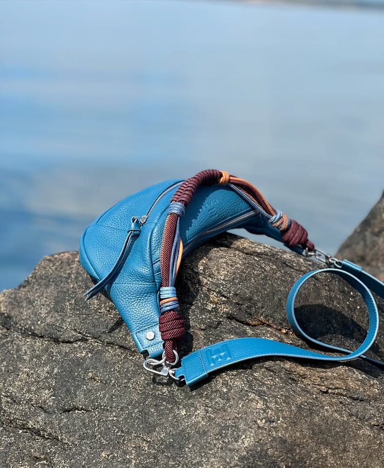 Crossover bag in duck blue 100% genuine french bull leather Halm handbag with burgundy and blue rope handle. Available to shop at The Halm Collective Concept Store on Jumeirah Beach Road.