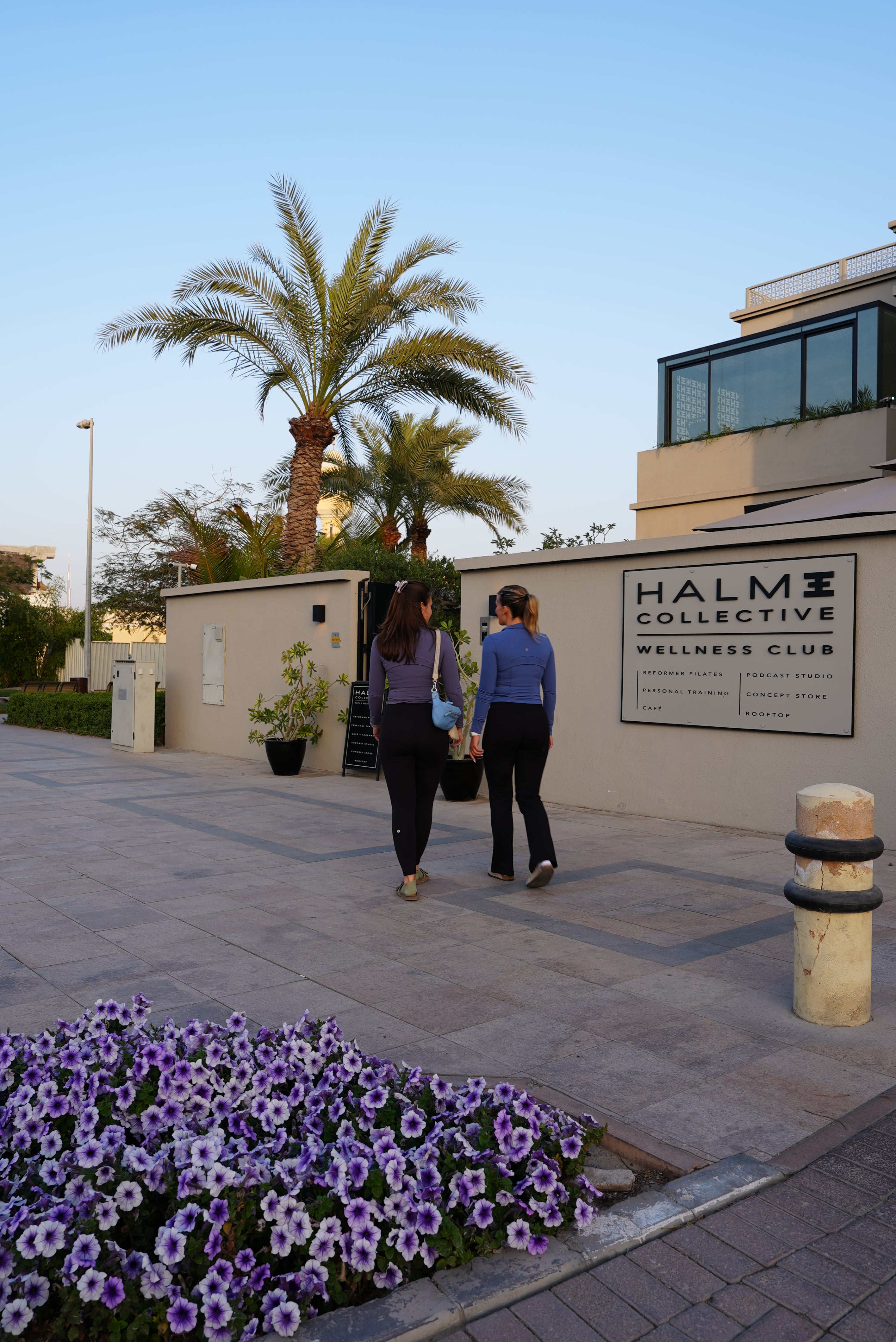 two girls entering a boutique wellness club in jumeirah